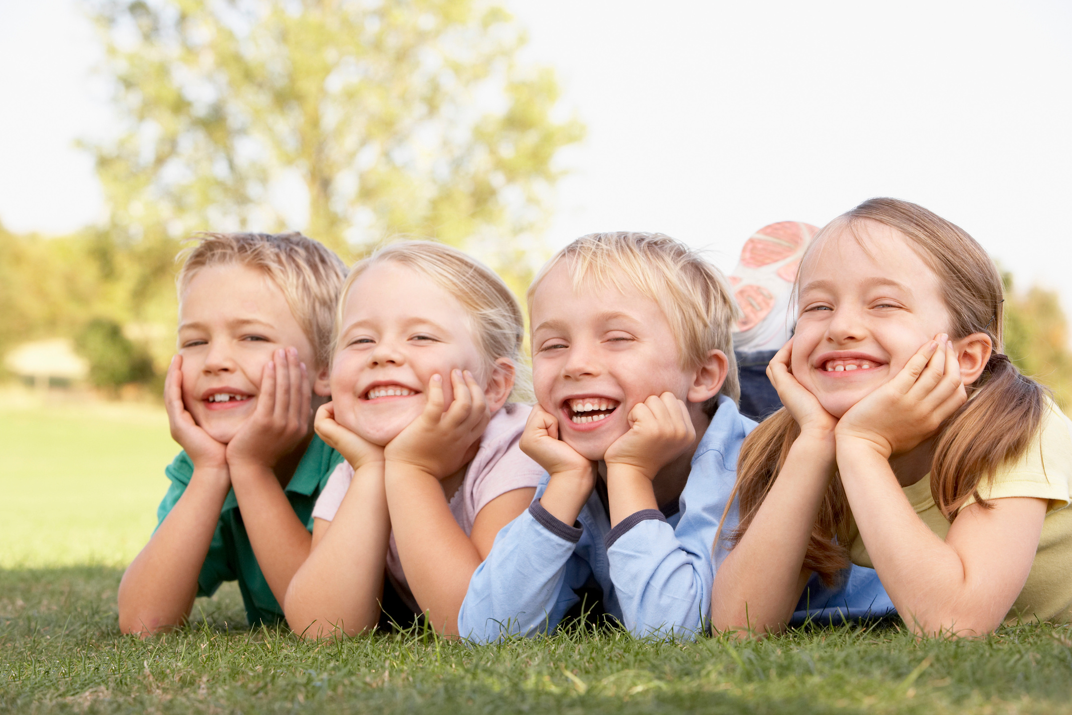 Kids smiling outdoors
