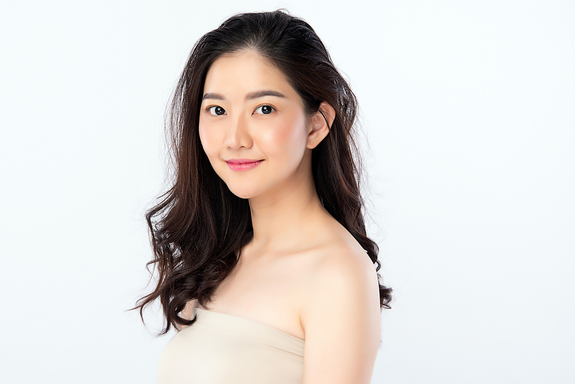 Beautiful Young Asian Woman with Clean Fresh Skin